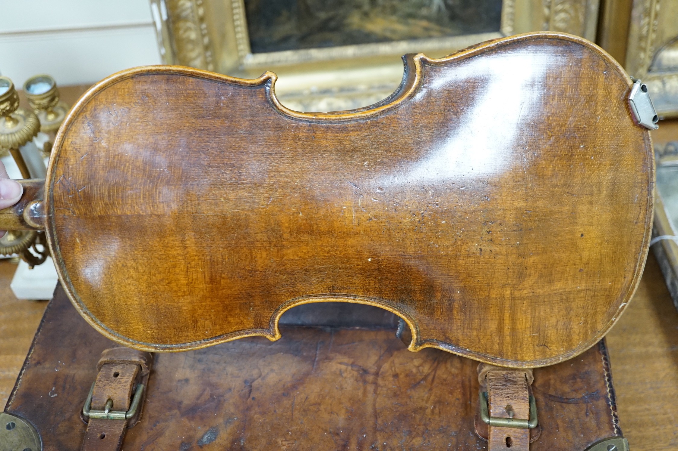 A late 19th century German violin together with an Italian mandolin, (both cased)